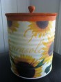lata decorada com desenho de gira sol